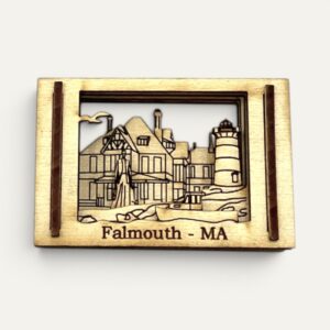 Front view of the Falmouth MA Matchbox Miniature showing a lighthouse and seaside house in layered wood