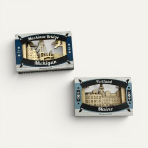 Two Matchbox Miniatures in their new printed sleeve packaging, Mackinac Bridge Michigan and Portland Maine, seen from straight above
